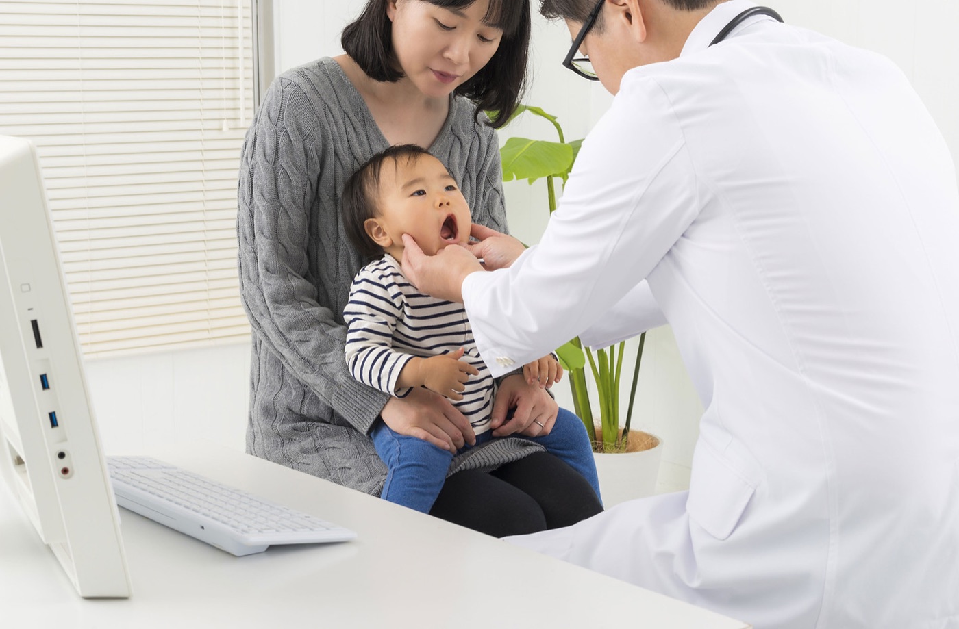 Pediatrician caring for baby